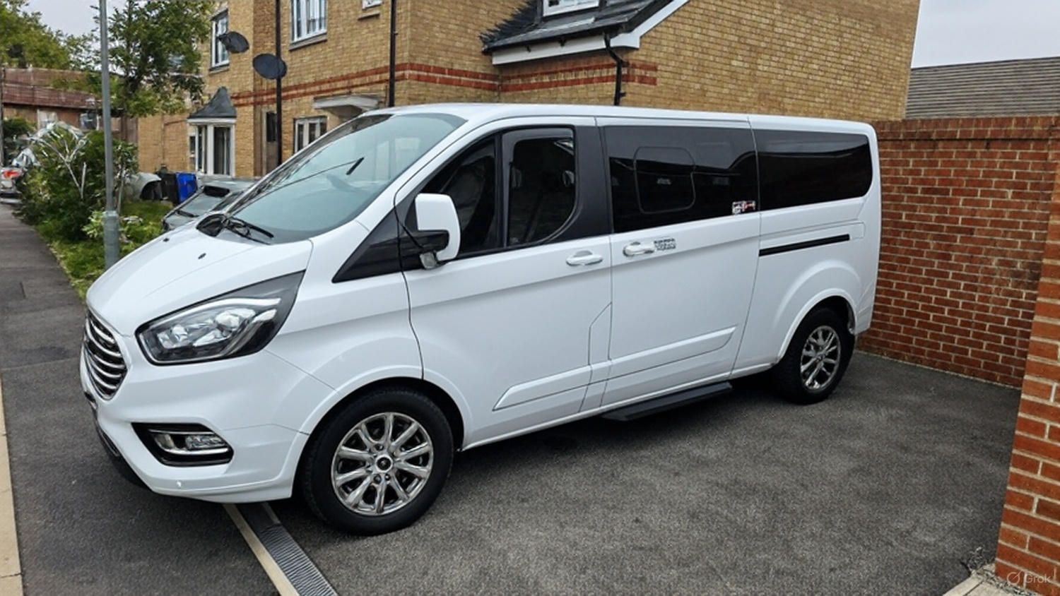 white minibus on a drive